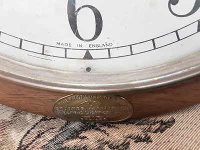 Lot 4 - Early 20th century Enfield circular wall clock in oak case, dial is 30cm diameter,  bearing label - The Property Of The St James And Pall Mall Electric Light Co Limited
