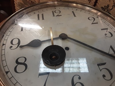 Lot 4 - Early 20th century Enfield circular wall clock in oak case, dial is 30cm diameter,  bearing label - The Property Of The St James And Pall Mall Electric Light Co Limited