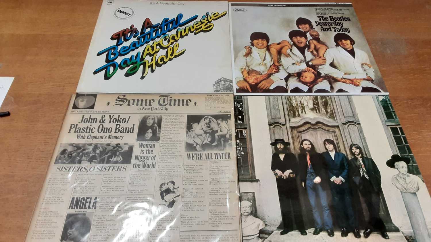 Lot 2315 - Two vintage cases of LP records including Rolling Stones, Beatles, John Lennon, Led Zeppelin, Jefferson Airplane, Zappa, Buddy Holly and Spencer Davis, most discs in very good or excellent conditio...
