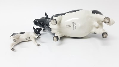 Lot 91 - Beswick Friesian Cow - CH Claybury Legwater, model no. 1362A, designed by Arthur Gredington, 11.9cm high, together with Friesian Calf (2)