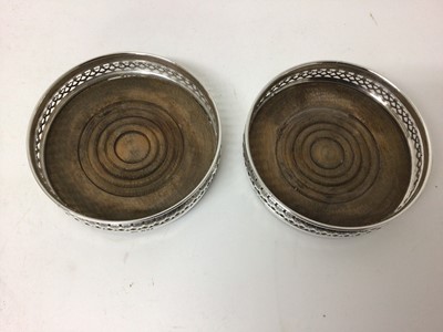 Lot 726 - Pair of sterling silver wine coasters