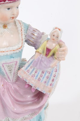 Lot 55 - Meissen figure of a girl with a doll
