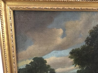 Lot 10 - oil on canvas landscape with fishermen in boat on a lake and village beyond, 52cm x 42cm in gilt frame