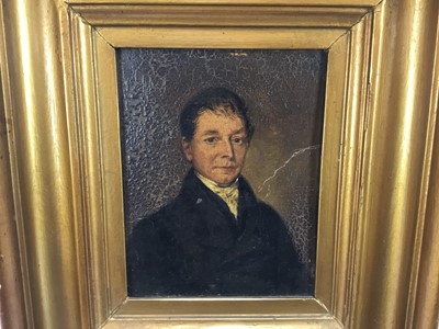 Lot 57 - English School early 19th Century oil on board - A half length portrait of a gentleman, 16cm x 13cm, in period gilt frame
