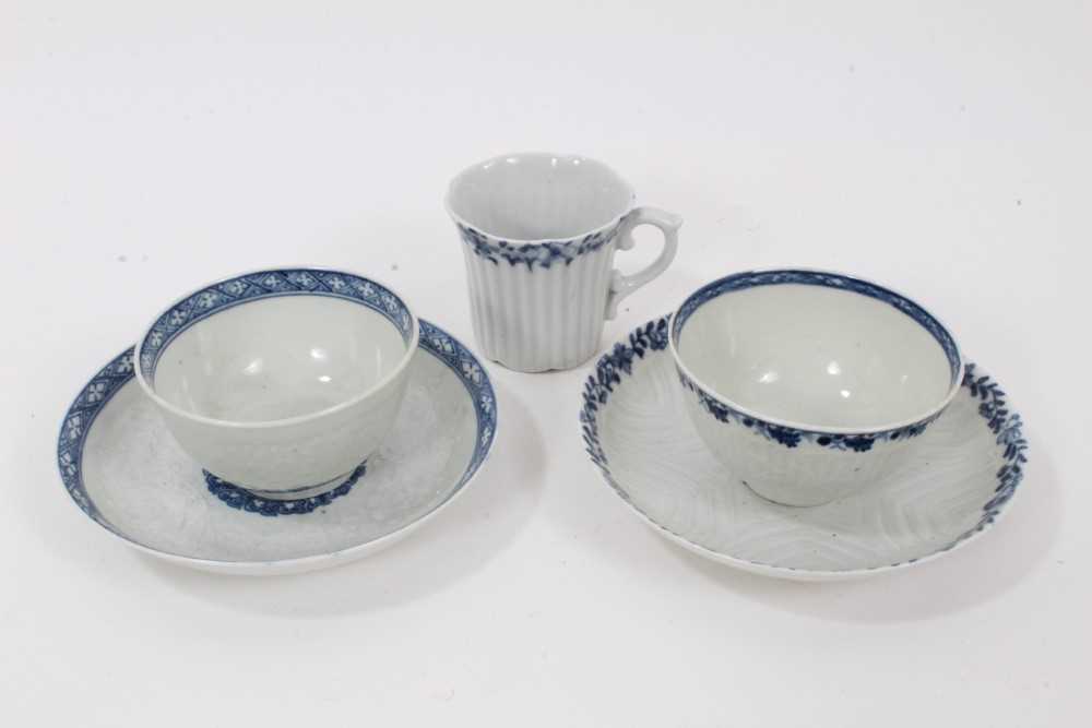 Lot 53 - Worcester blue and white moulded tea wares, circa 1780, including a tea bowl and saucer with floral moulding, and a cup, tea bowl and saucer (5)