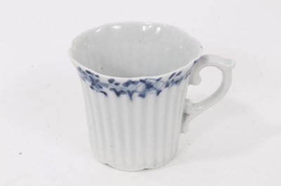 Lot 53 - Worcester blue and white moulded tea wares, circa 1780, including a tea bowl and saucer with floral moulding, and a cup, tea bowl and saucer (5)