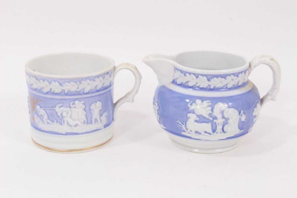 Lot 27 - A New Hall mug, with applied decoration, on a lilac ground, and dated 1819, and a similar jug