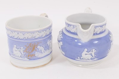 Lot 27 - A New Hall mug, with applied decoration, on a lilac ground, and dated 1819, and a similar jug