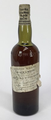 Lot 80 - Whisky - one bottle, Black & White Special Blend Of Choice Old Scotch Whisky, 1930s-1940s, spring cap bottling, 70° proof, with presentation inscription to the label dated 1941