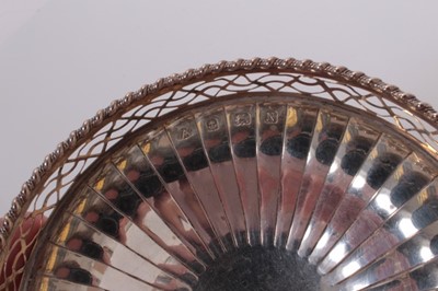 Lot 149 - Pair of George VI silver bonbon dishes with pierced borders on pedestal bases, (Birmingham 1937), maker Adie Brothers 3ozs, 11cm in diameter (2).