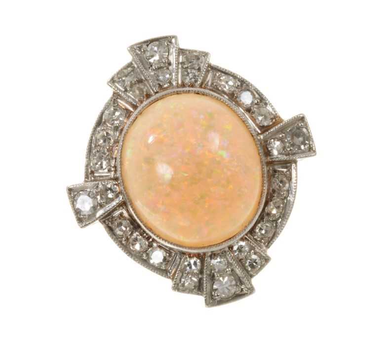 Lot 513 - Art Deco style opal and diamond cluster ring with an oval cabochon opal surrounded by a border of diamonds in platinum millegrain setting with pierced gold gallery on gold shank.