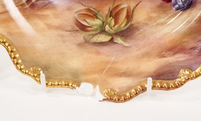 Lot 241 - A pair of Royal Worcester plates painted with fruit, signed by H.H. Price, 22.5cm across