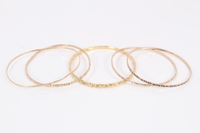 Lot 52 - Five gold/yellow metal bangles