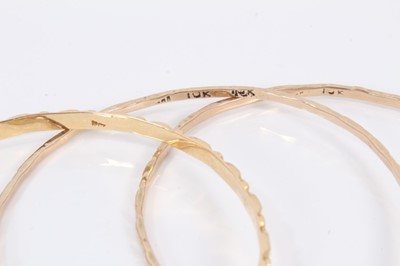 Lot 52 - Five gold/yellow metal bangles