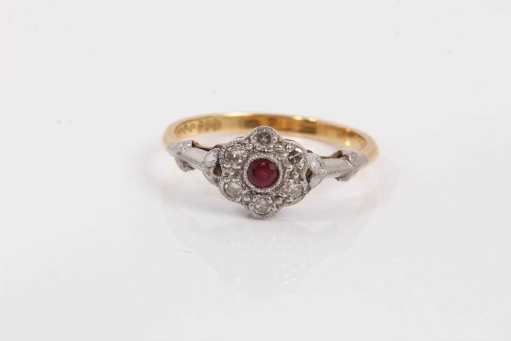 Lot 40 - Ruby and diamond cluster ring with a daisy head cluster with central ruby and single cut diamonds in platinum setting on 18ct yellow gold shank.