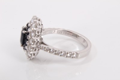 Lot 140 - 18ct white gold sapphire and diamond cluster ring