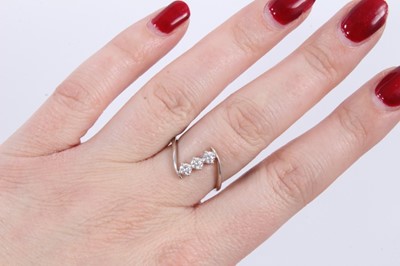 Lot 77 - 18ct white gold diamond three stone ring
