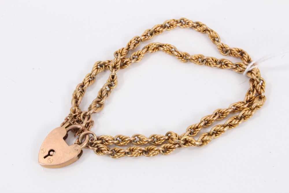 Lot 107 - 9ct gold two strand rope twist bracelet with padlock clasp