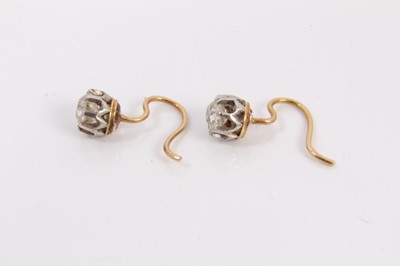 Lot 117 - Pair of antique diamond single stone earrings, each with an old cut diamond