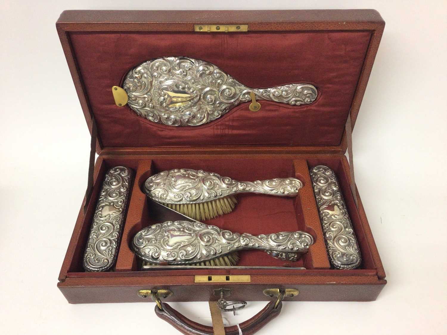 Lot 128 - Late Victorian silver backed dressing table set in fitted brown leather travel case