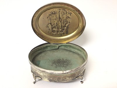 Lot 131 - Edwardian silver oval jewellery box on four legs with relief decoration to lid depicting a couple
