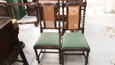 Lot 1037 - 1930s Jacobean Revival carved oak sideboard, together with a set of six 1930s oak dining chairs and draw leaf table