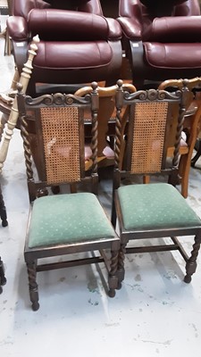 Lot 1037 - 1930s Jacobean Revival carved oak sideboard, together with a set of six 1930s oak dining chairs and draw leaf table