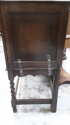 Lot 1037 - 1930s Jacobean Revival carved oak sideboard, together with a set of six 1930s oak dining chairs and draw leaf table