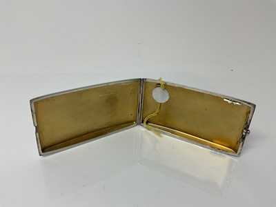 Lot 21 - George V silver cigarette case of rectangular form with engine turned decoration, gem set button and gilded interior, (Birmingham 1933), maker W T Toghill & Co, 9.3cm in overall length, all at 2.1o...