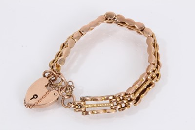 Lot 871 - 9ct rose gold gate bracelet with padlock clasp, within a small carved wood trinket box