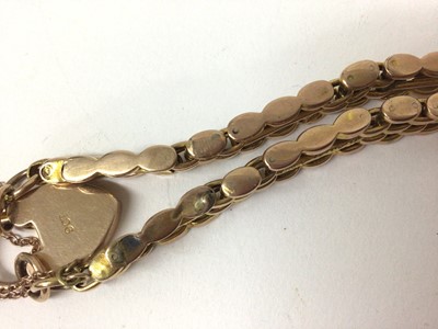 Lot 871 - 9ct rose gold gate bracelet with padlock clasp, within a small carved wood trinket box