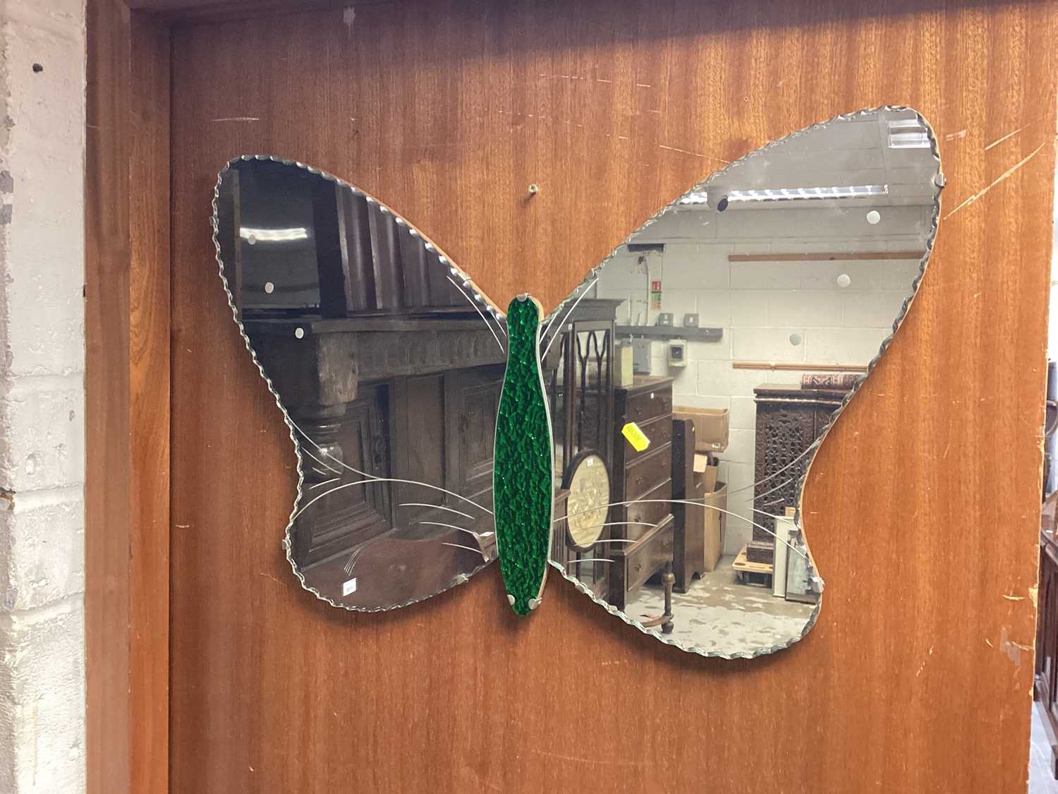 Lot 1130 - Two frameless wall mirrors, one in the form of a butterfly with green tinted body