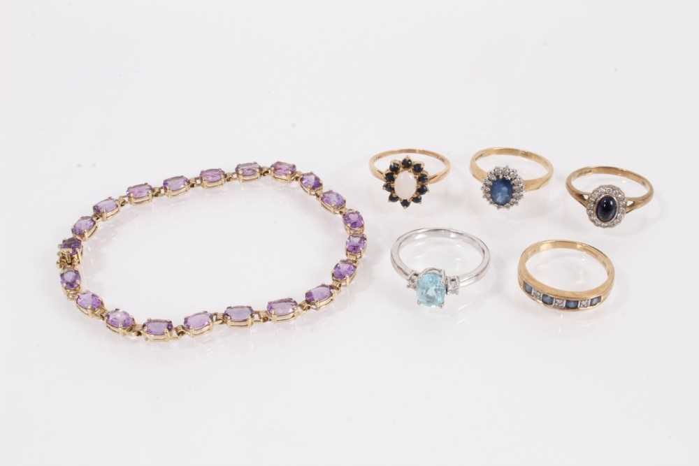 Lot 834 - Five 9ct gold gem set dress rings and 9ct gold gem set bracelet