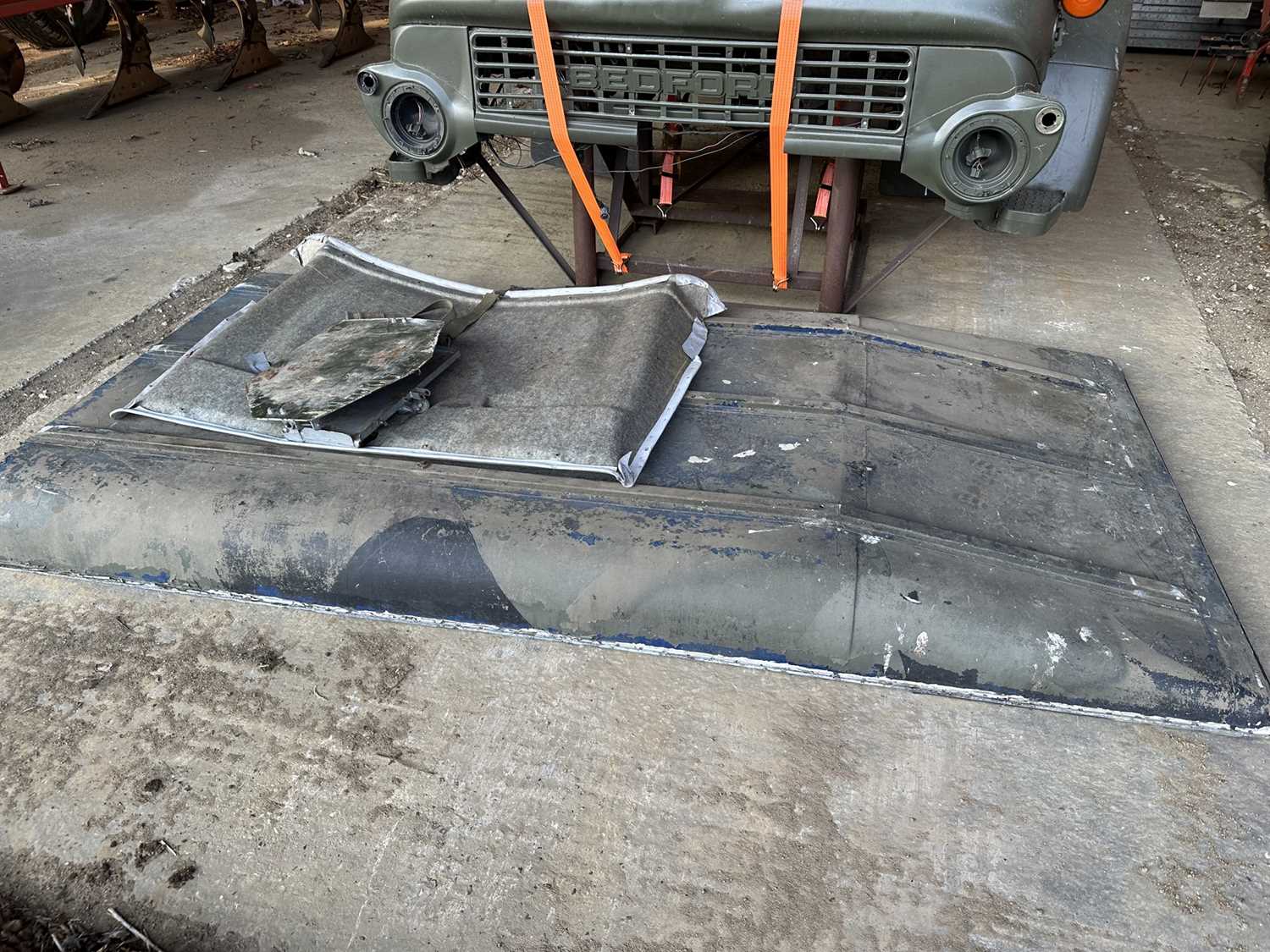Lot 30 - Group of assorted Land Rover spares to include a roof, buck and front wing, believed to be from an ex. British Army 110, sold without reserve (Subject to 12% buyers premium inclusive of VAT).
