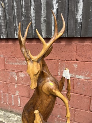 Lot 7 - Hardwood carving of two deer, 158cm high