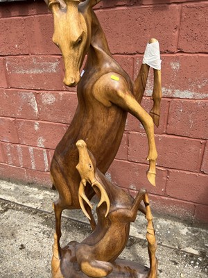 Lot 7 - Hardwood carving of two deer, 158cm high