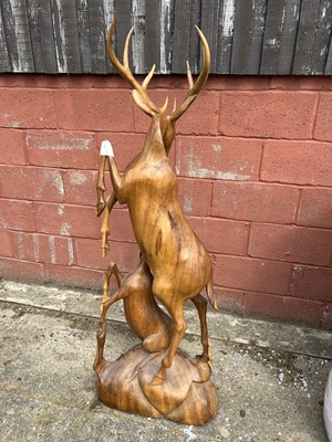 Lot 7 - Hardwood carving of two deer, 158cm high