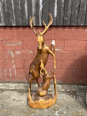 Lot 7 - Hardwood carving of two deer, 158cm high
