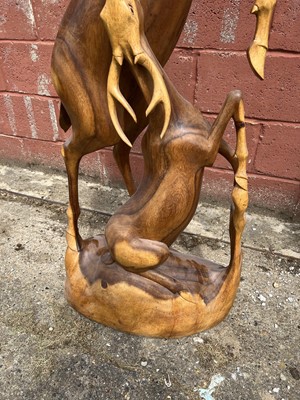 Lot 7 - Hardwood carving of two deer, 158cm high