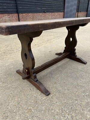 Lot 18 - Early 20th century oak refectory table, with plank top on trestle ends, 163 x 79cm