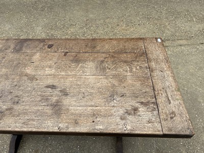 Lot 18 - Early 20th century oak refectory table, with plank top on trestle ends, 163 x 79cm