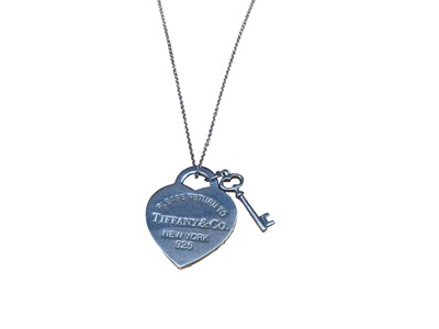 Lot 188 - Tiffany & Co silver 'Return to Tiffany' heart tag with key pendant on chain, with pouch and box