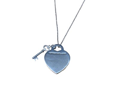 Lot 188 - Tiffany & Co silver 'Return to Tiffany' heart tag with key pendant on chain, with pouch and box