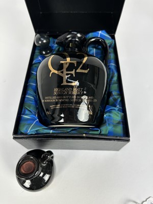 Lot 28 - Whisky - two bottles, QE2 Highland Malt Scotch Whisky 75cl ceramic flagon 43%, in presentation box, together with a miniature version (2)