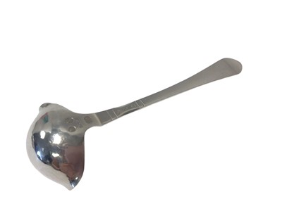 Lot 14 - A Georg Jensen Danish silver double-lipped cream ladle with hammered bowl, Copenhagen mark for 1924, London import marks, 12.5cm long