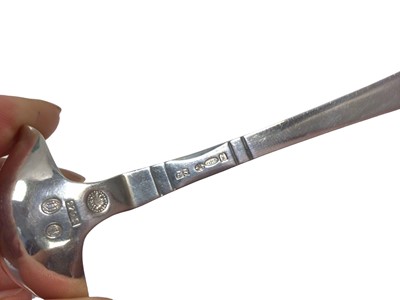 Lot 14 - A Georg Jensen Danish silver double-lipped cream ladle with hammered bowl, Copenhagen mark for 1924, London import marks, 12.5cm long