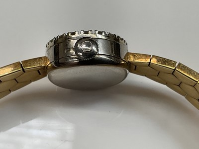 Lot 441 - 1950s ladies 18ct gold Omega wristwatch with diamond bezel
