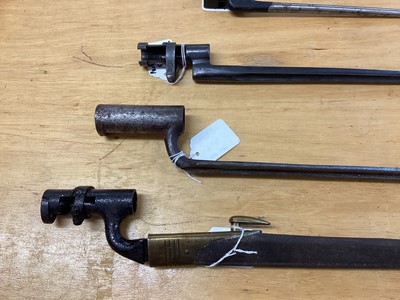 Lot 862 - Second World War No. 4 MK II spike bayonet, together with an Enfield socket bayonet in brass mounted leather scabbard and two other socket bayonets (4)