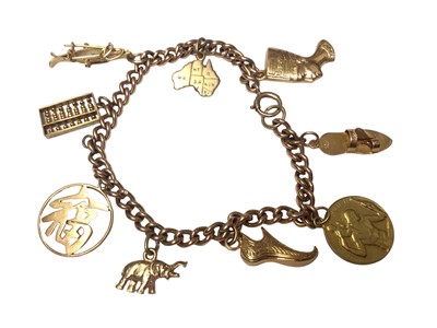 Lot 36 - Group of 9ct gold jewellery to include a torque bangle, a gold charm bracelet, two wedding rings, bracelet and chain