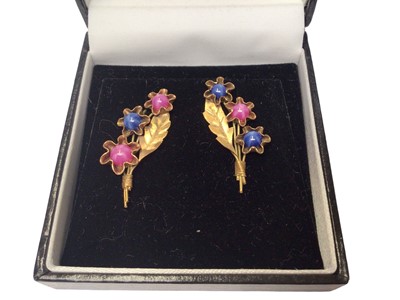 Lot 37 - Group of gold gem set earring to include a pair of 18ct gold synthetic star sapphire and star ruby floral spray earrings, pair of 18ct white gold ruby and diamond cluster earrings